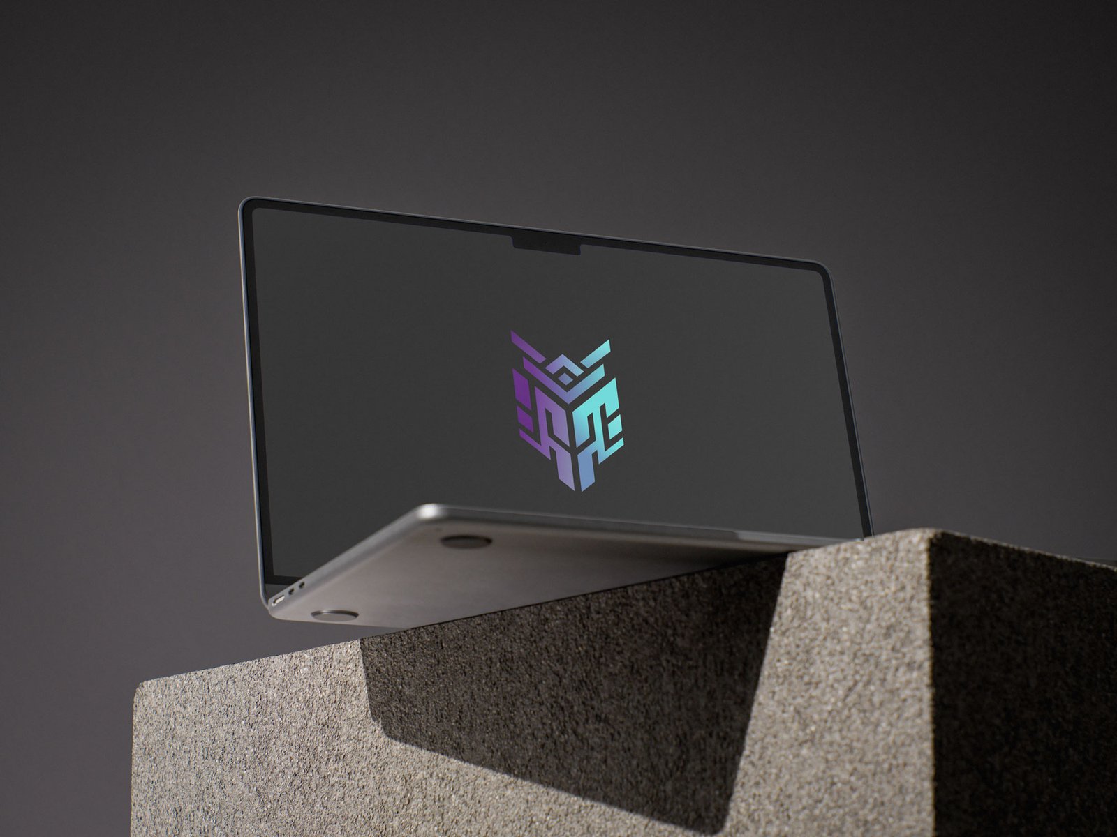 macbook on stone mockup